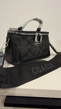 Жіноча сумка бочонок з логотипом Coach на текстильному ремінці екошкіра чорна
