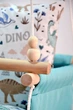 Детская качеля подвесная тканевая Infancy Динозавры из натурального дерева мятная основа от 7 месяцев до 5 лет - изображение 2