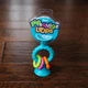 Прорезыватель-погремушка на присосках Fat Brain Toys pipSquigz Loops бирюзовый (FA166-1) - изображение 4
