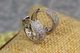 Серьги кольца Xuping Jewelry широкие из мелких фианитов посередине цветочек 1.5 см серебристые - изображение 2