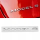 Логотип эмблема на крышку заднего багажника Tesla Model S 1013738-00-C - изображение 2