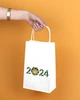 Пакет на Новый год 2024 eko-kraft 150х90х240 мм 10 шт/уп Маленький подарочный пакетик з ручками для гостинцев и сувениров "Символ Дракон" - изображение 2