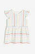Плаття бавовняне з воланами для дівчинки H&M 0928133-042 104 см (3-4 years) Різнобарвний - зображення 1