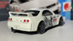 Машинка Базова Hot Wheels Nissan Skyline GT-R R33 Godzilla J-Imports 1:64 HTC44 White - зображення 4