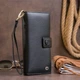 Шкіряний гаманець жіночий на хлястиці з кнопкою ST Leather 19280 чорний - зображення 7