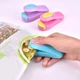 Ручной запайщик пакетов на батарейках АА Korea Type Mini Sealing Бирюзово-фиолетовый запаиватель пленки (1009618-Other-4) - изображение 2