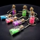 Сувенир брелок стеклянная бутылочка внутри цветные гранулы светонакопитель и натуральная ракушка - изображение 1