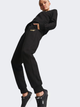 Spodnie dresowe damskie ocieplane Puma Ess+ Metallic Pants Fl 849959-01 M Czarne (4065449204774) - obraz 1