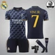 Комплект футбольная детская форма Lion SPORT Real Madrid VINI JN. (ВИнисиус Жуниор) 7, с гетрами (размер 34-38) и щитками, размер 30 размер, рост 150-160 см, черный с оранжевым - изображение 1