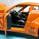 Машинка Auto Expert Nissan GTR металева 1:32 світло/звук/інерційна Помаранчева (38071) - зображення 7