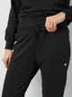 Спортивные штаны на флисе женские Champion 113219-KK003 S Черные (8054112525441) - изображение 4