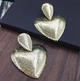 Сережки женские бижутерия "Сердца" рельефные jeweston золотого цвета - изображение 2