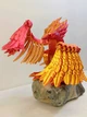 Игрушка-антисстрес подвижный Феникс градиент красно-золотой - изображение 1