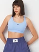 Спортивный топ для фитнеса женский New Balance Essential Train Bra WB51035ELE XS Голубой (197967334207) - изображение 4