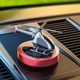 Багаторазовий ароматизатор в автомобіль дифузор у формі вертольота червоний з металу на сонячній батареї з ароматом Морський бриз діаметром платформи 59 мм вагою 500 грам (AW-1394) - зображення 1