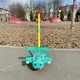 Игрушка каталка детская вертолет с ручкой, со звуком звоночка, движущиеся элементы глаза и язык, подсвечивание бирюзовый - изображение 6