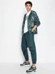 Футболка хлопковая длинная мужская Armani Exchange 533091524 2XL Белая с принтом (1159830013) - изображение 3