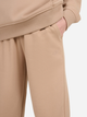 Spodnie dresowe dziewczęce joggery 4F 4FJWSS25TTROF1187-83S 128 cm Beżowe (5905700426165) - obraz 5