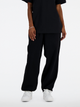 Spodnie dresowe damskie luźne New Balance Nb Athletics WP41513 L Czarne (197375437637) - obraz 4