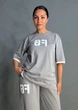 Костюм жіночий CAPPITONE 101190 оверсайз футболка з нашивкою FG та штани палаццо на резинці M сірий - зображення 6