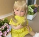 Реалистичная кукла Реборн Reborn 55 см девочка анатомическая винил силикон блондинка улыбка в желтом - изображение 2