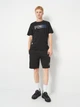 Футболка хлопковая длинная мужская Puma Essentials Graphics 68818401 2XL Black с принтом (4069157690737) - изображение 3