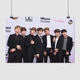 Постер БТС, у стены с логотипами, Bangtan Boys, BTS, кейпоп, A3 28×42 см (id2648) - изображение 1