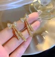 Женские сережки Бантики в стразах и камушках jewelry Золотистые-белые - изображение 3