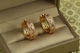 Серьги кольца Хuping Jewelry с рисунками треугольники 2,1 см золотистые - изображение 1