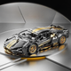 Конструктор сіро-золотий Lamborghini 1:14 – рульовий механізм, диференціал - зображення 2