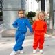 Штани спортивні трикотажні для дівчаток Trendy Tot 03-01558 оранжевий 86 см (18 мiс.) - зображення 4
