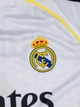 Детская футбольная форма Real Madrid 2025/26 — Kylian Mbappé №10 (домашняя, белая), размер 18 (рост 105–110 см) - изображение 2