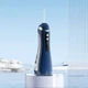 Ирригатор портативный для зубов и дёсен Dental Oral Irrigator 200 мл + 4 насадки Синий - изображение 3