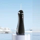 Іригатор портативний для зубів та ясен Dental Oral Irrigator 200 мл + 4 насадки Чорний - зображення 12