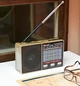 Радиоприемник Golon RX от сети, аккумулятора, батареек с фонариком USB TF microCD картридер золотой (6688) - изображение 1