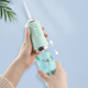 Ирригатор для полости рта ORAL IRRIGATOR 3 режима с насадками зеленый - изображение 6