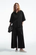 Кюлоти жіночі COS elasticated pleated culottes 1221419001 34 Чорний - зображення 1