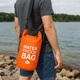 Сумка-мешок водонепроницаемая Ocean Pack 2л оранжевая с лямкой через плечо для защиты вещей от влаги и воды - изображение 2