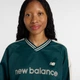 Жіночий бірюзовий реглан New Balance Satin Woven Pullover 34 (XS) (WT61145IAAV) - зображення 4