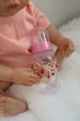 Лялька Реборн Reborn Doll 50 см, реалістична вініл-силіконова дівчинка пупс в рожевому одязі+аксесуари - зображення 8