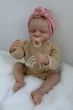 Кукла Реборн Reborn Doll 50 см, реалистичная винил-силиконовая девочка пупс закрытые глаза в одежде+аксессуары - изображение 3