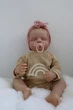 Кукла Реборн Reborn Doll 50 см, реалистичная винил-силиконовая девочка пупс закрытые глаза в одежде+аксессуары - изображение 4