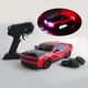 Машинка для дрифта на радиоуправлении Dodge Challenger Hellcat 4WD 1:14 с паром, неоновой подсветкой, сменными колесами, 27 см (Red) - изображение 1