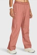 Брюки женские Under Armour Ua Rush Os Woven Pant M Персиковий 1382739-696 - изображение 1