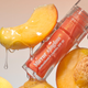 Сонцезахисний блиск для губ HUGS Mirror Sungloss Spurkling Bellini SPF 20+ PA++ 5,5 мл - зображення 5