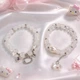 Парные браслеты Hello Kitty белый и серебристый с бусинами 8 мм на резинке, акрил + бижутерный сплав - изображение 12