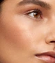 Кремовий хайлайтер повномірний 5g Westman Atelier Lit Up Cream Highlighter Stick Brûlée Glassy bronze gold - изображение 3