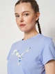 Футболка бавовняна жіноча Puma Graphics Floral Cat Tee 69191260 XS Intense Lavender (4069161742323) - зображення 4