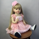 Лялька реборн Reborn Baby Doll Bella у рожевій сукні 55 см, вінілова, з волоссям та аксесуарами, можна купати (RB051) - изображение 1