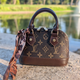 Брендова жіноча сумка Louis Vuitton Alma Nano Mini Monogram коричнева з ручками - зображення 2
